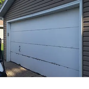 A defective garage door that won't fully close.